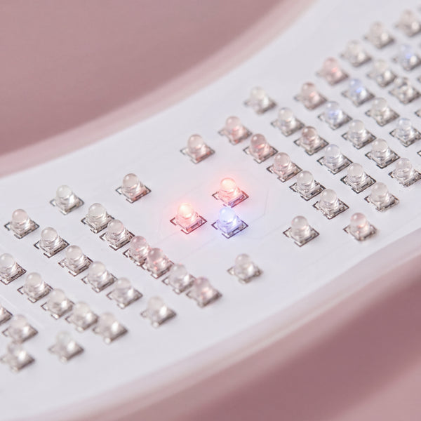 Close-up of the NEWKEY 4D LED Therapy Mask showing individual LED lights with a subtle, precise glow, emphasizing calibration