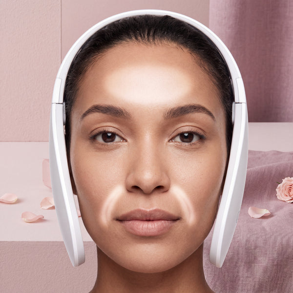 Close-up of a diverse model's forehead and nasolabial folds, subtly glowing, with the NEWKEY 4D LED Therapy Mask partially vi